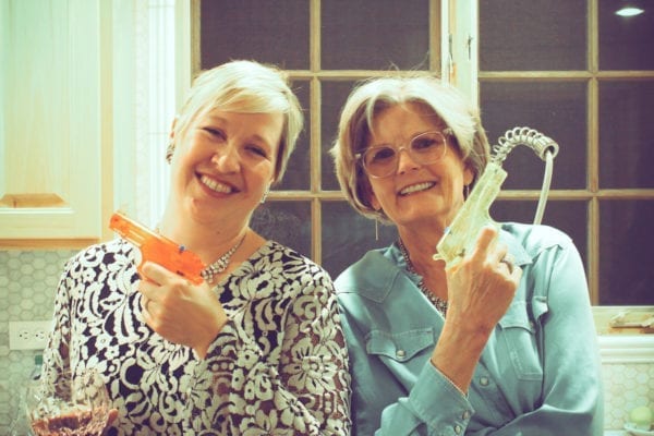 Photo of Barb and Traci posing with water pistols